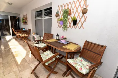 a dining room with a table and chairs at Marilyn Apartment in Budva