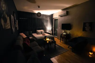 a living room with a bed and a couch at Marilyn Apartment in Budva