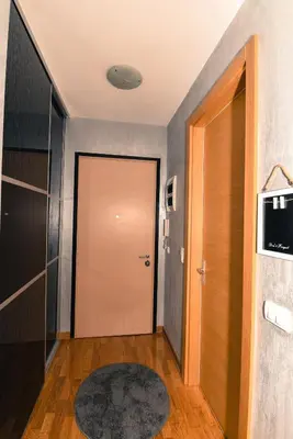 a hallway with a door and a rug at Marilyn Apartment in Budva