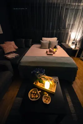 a hotel room with a bed and a tray of food at Marilyn Apartment in Budva