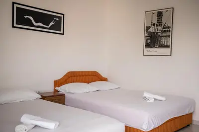 two beds sitting next to each other in a room at Villa Perla in Utjeha