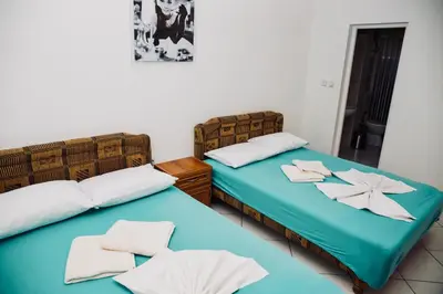 two beds sitting next to each other in a room at Villa Perla in Utjeha
