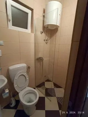 a small bathroom with a toilet and a shower at More i Vuk in Bar