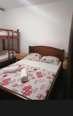 a bed with a hello kitty quilt on it at levent 2 in Kotor