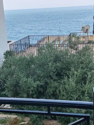 a view of the ocean from a balcony at Villa Contact in Dobra Voda