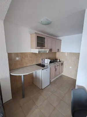 a kitchen with a table and a counter top at Villa Contact in Dobra Voda