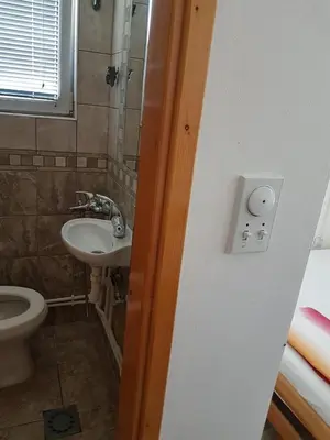 a bathroom with a sink and a toilet at Family Apartments Pepic in Ulcinj