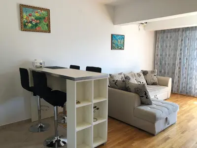 a living room with a table and a couch at Apartment Marina in Bar