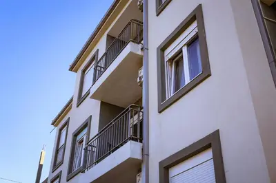 a building with balconies on the side of it at Apartman Zorana in Tivat