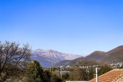 a view of a mountain range with mountains in the background at Apartman Zorana in Tivat