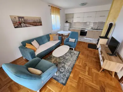 a living room with a couch and a table at Apartments Donja Gorica in Podgorica