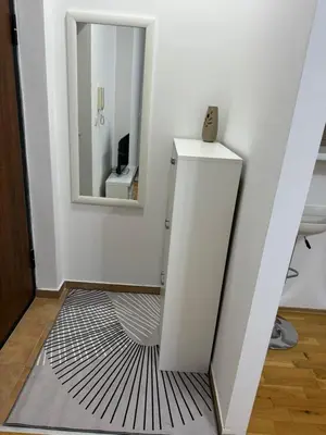 a bathroom with a sink and a mirror at N&J apartman in Podgorica