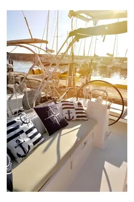 a boat with pillows sitting on top of it at Yacht Hotel Kotor Marina in Kotor