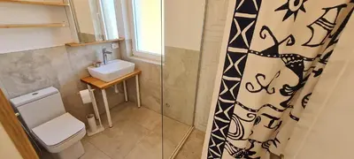 a bathroom with a toilet and a sink at Sunrise Lodge in Dapčevići