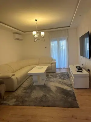a living room with a couch and a table at Monte Budva in Budva
