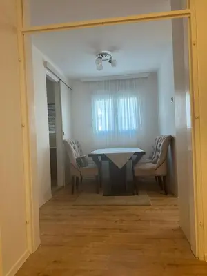 a dining room with a table and chairs at Monte Budva in Budva