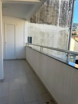 an empty room with a balcony and a window at Monte Budva in Budva