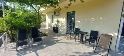 a group of chairs sitting outside of a building at Apartment Wild Beauty in Kotor