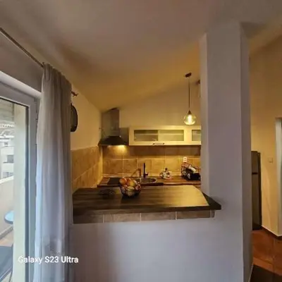 a kitchen with a sink and a counter top at Studio Ines in Kotor