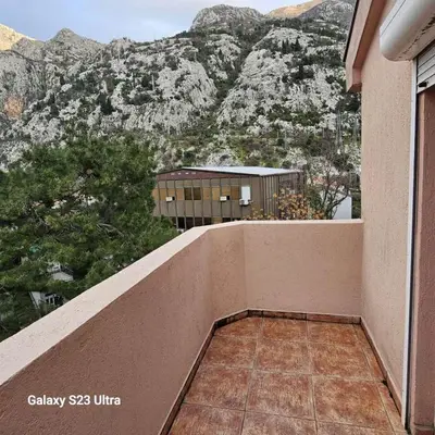 a balcony with a view of a mountain at Studio Ines in Kotor
