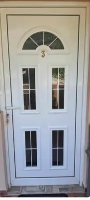 a white door with a window on it at Apartments Masa in Sutomore
