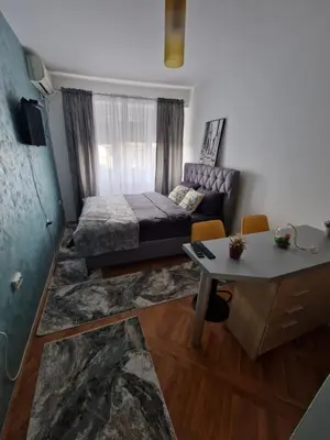 a living room with a couch and a table at Riverview in Podgorica