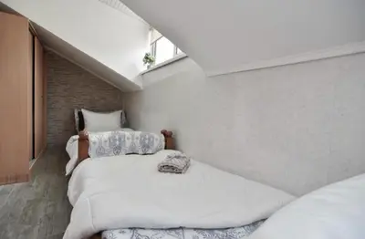 a bedroom with two beds and a window at One bedroom apartment Old town in Budva