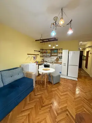 a living room with a couch and a table at Coasthouse Budva in Budva