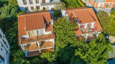 an overhead view of two apartment buildings with orange roofs at Apartments Luka in Budva