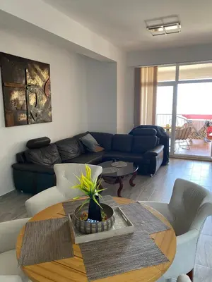 a living room with a couch and a table at Apart Bella Utjeha Sea View 68 qm in Utjeha