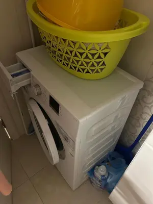 a yellow bucket on top of a white refrigerator at Apart Bella Utjeha Sea View 68 qm in Utjeha