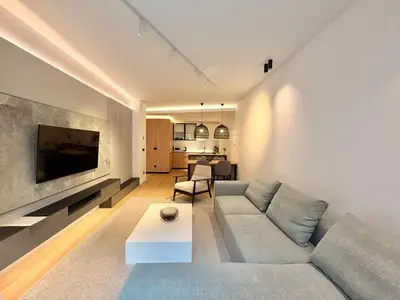 a living room with a couch and a tv at Air Onia in Budva