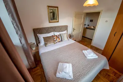 a bedroom with a large bed in a room at Mediteraneo Villa in Kaluđerovići
