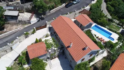 an overhead view of a house and a swimming pool at Mediteraneo Villa in Kaluđerovići