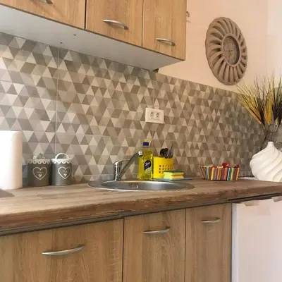 a kitchen counter with a sink in a kitchen at Casa Calda Apartments in Cetinje