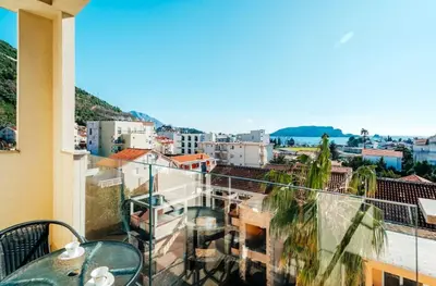 a balcony with a view of a city at Sea-view PD38 by In Property in Budva