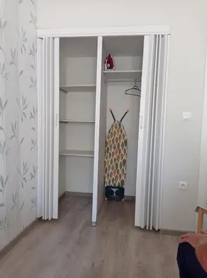 a room with a closet with a door open at Dubrava 112 in Dobra Voda