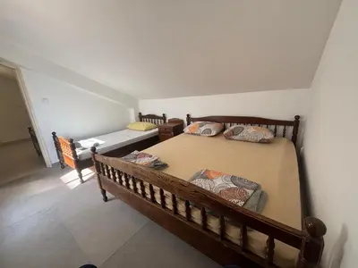 a bedroom with two beds in a room at Apartman Horizont in Petrovac na Moru