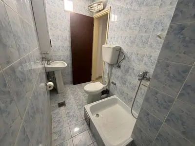a bathroom with a toilet and a sink at Apartman Horizont in Petrovac na Moru