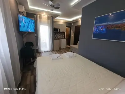 a bedroom with a white bed in a room at Villa Sun Budva in Budva