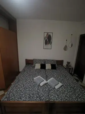 a bedroom with a bed with two pillows on it at Nikolaj in Podgorica
