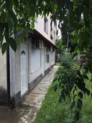 a building with a white door on the side of it at Nikolaj in Podgorica