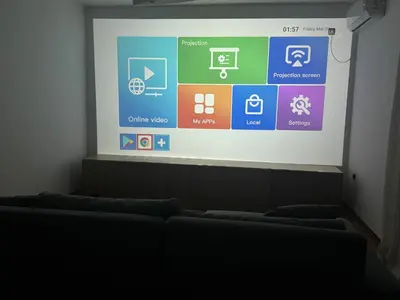 a projection screen in a room with a row of couches at Villa Bait in Bar