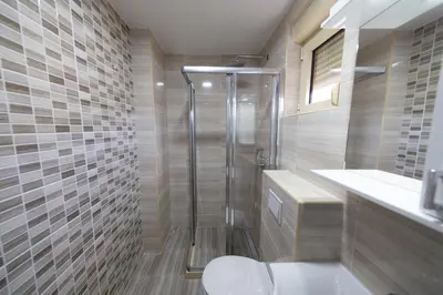 a bathroom with a shower and a toilet at Luča Apartments in Budva