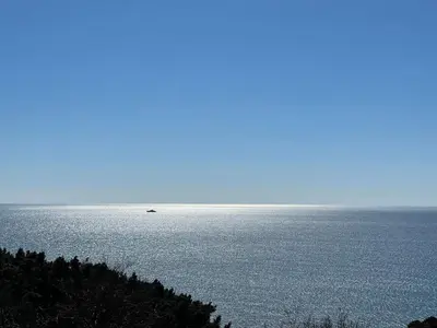 a boat in the middle of a large body of water at SOHO Apartments in Ulcinj