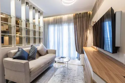 a living room with a couch and a flat screen tv at Hana in Pržno