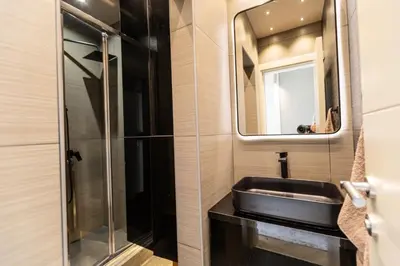a bathroom with a sink and a mirror at Hana in Pržno