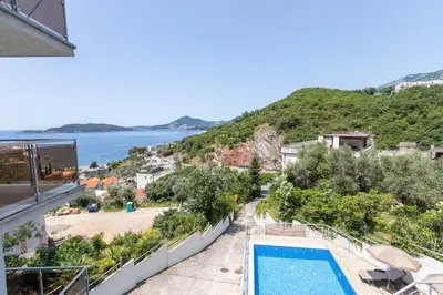 a view from the balcony of a resort with a swimming pool at Hana in Pržno