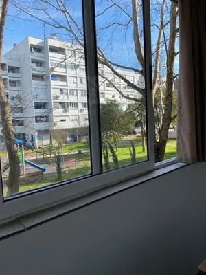 a window with a view of a park at Golden Nook in Podgorica