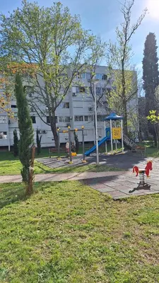 a park with a playground with at Golden Nook in Podgorica